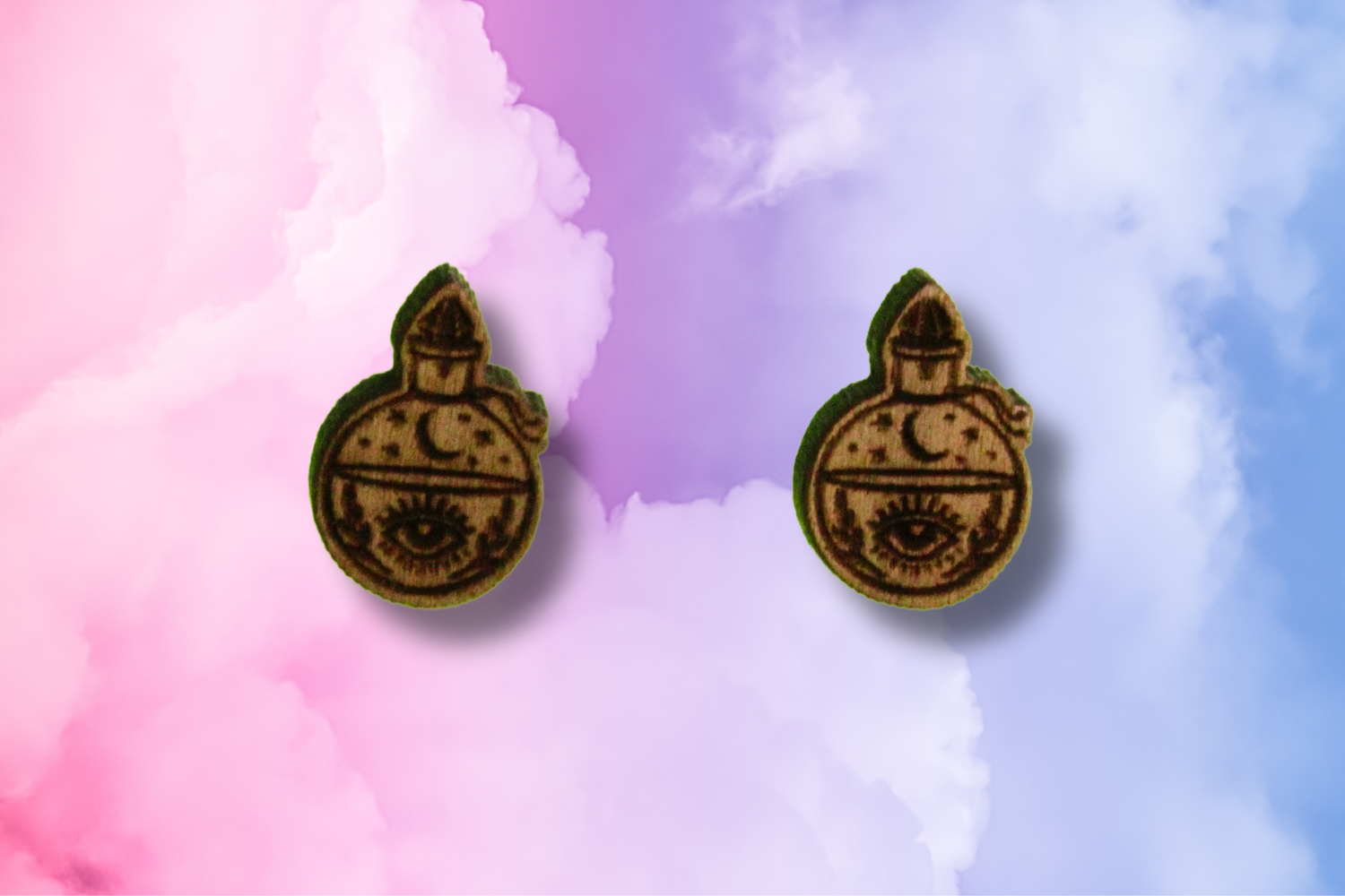 Pair of earrings with a potion bottle design on a colorful background